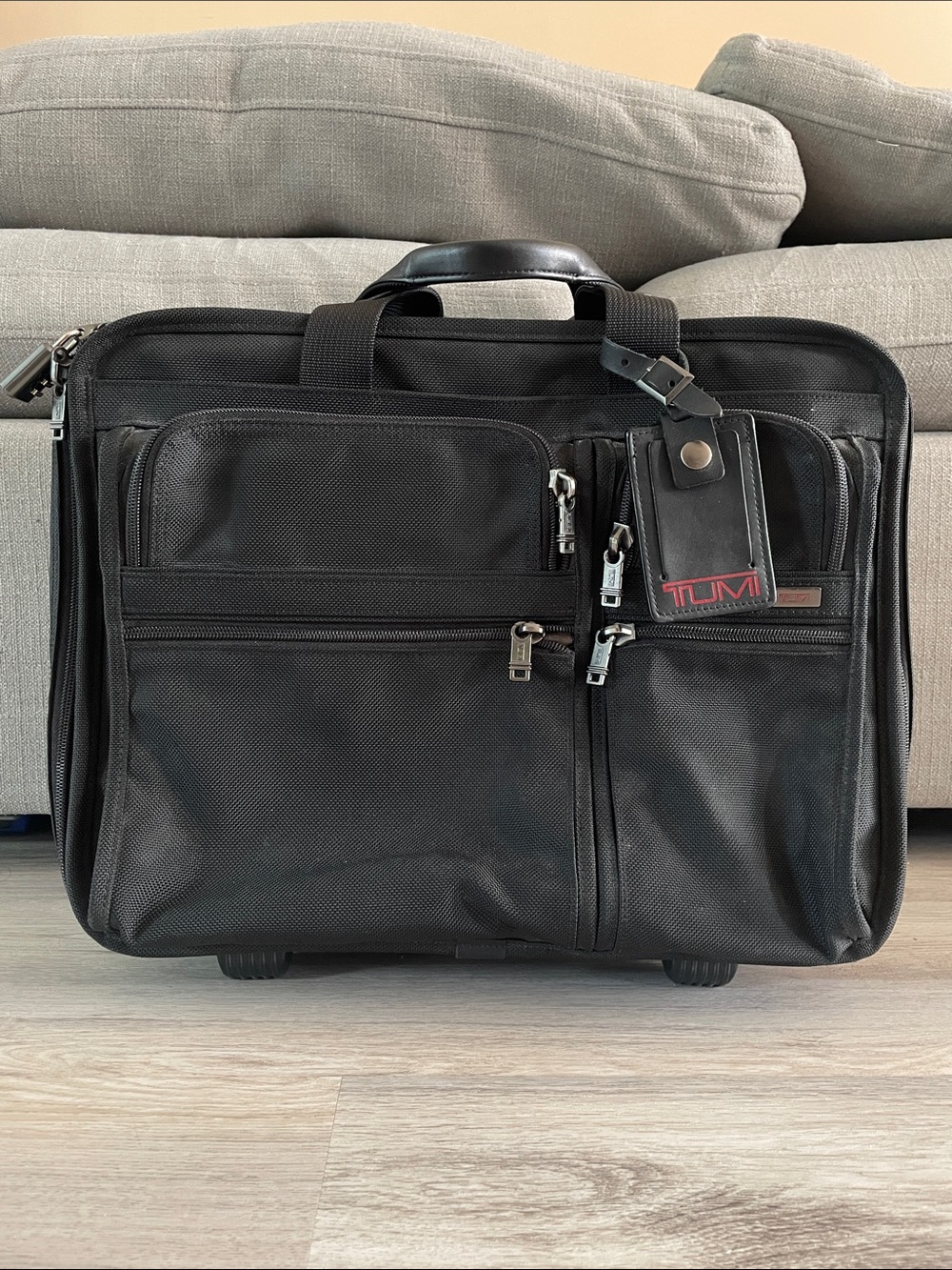 Tumi Black Rolling Briefcase with Leather Trim and Luggage Tag